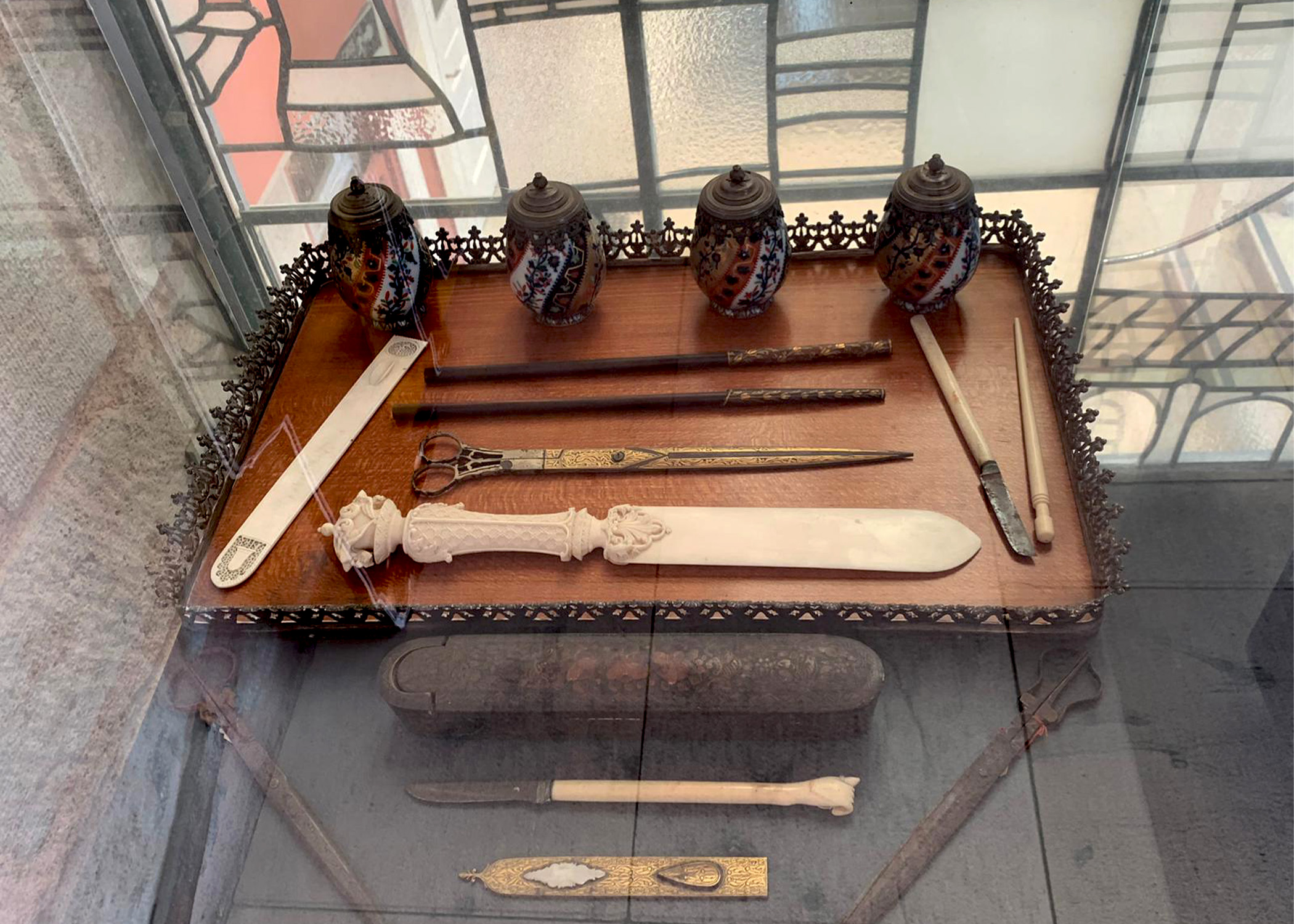 A traditional writing set with inkwell and pens